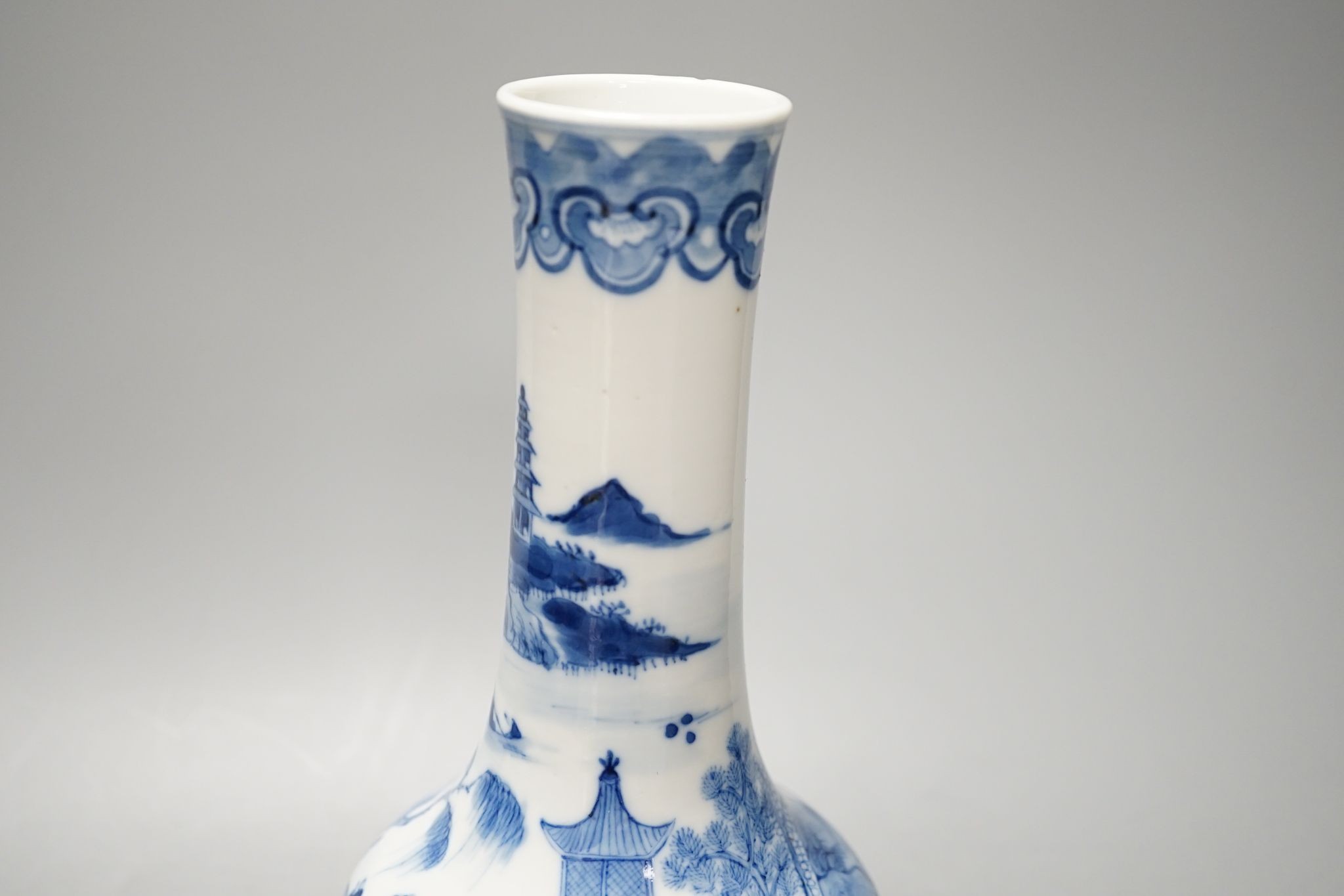 A Chinese blue and white bottle vase, Kangxi mark but 19th century. 25cm